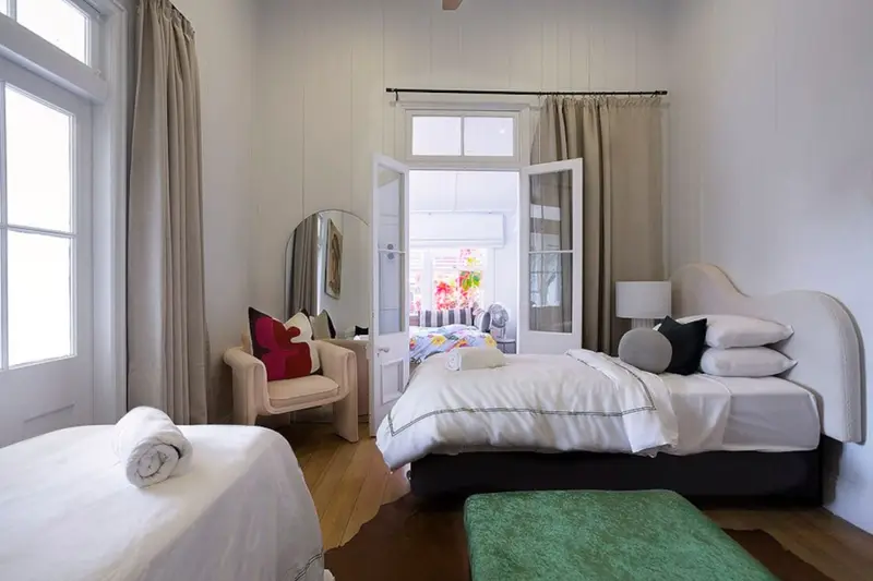 Twin bedroom with french doors opening to the verandah