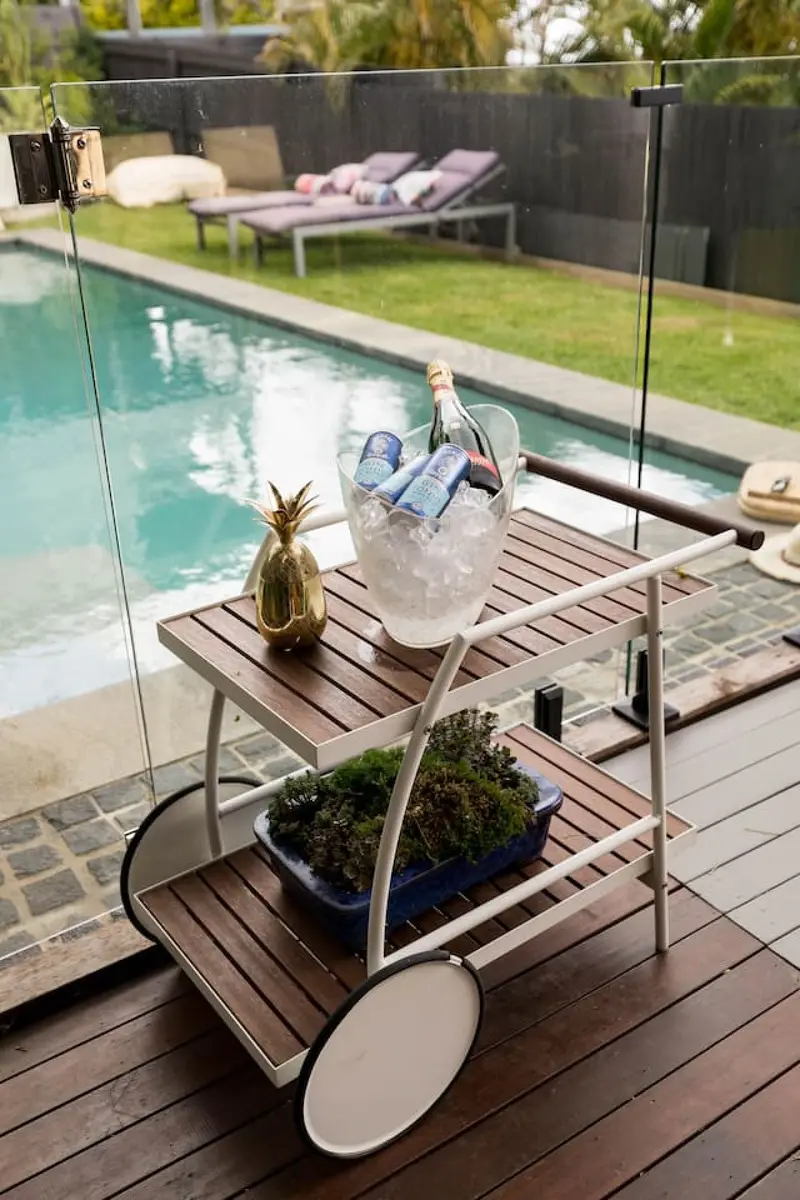 Drinks trolley with an ice bucket on the pool deck